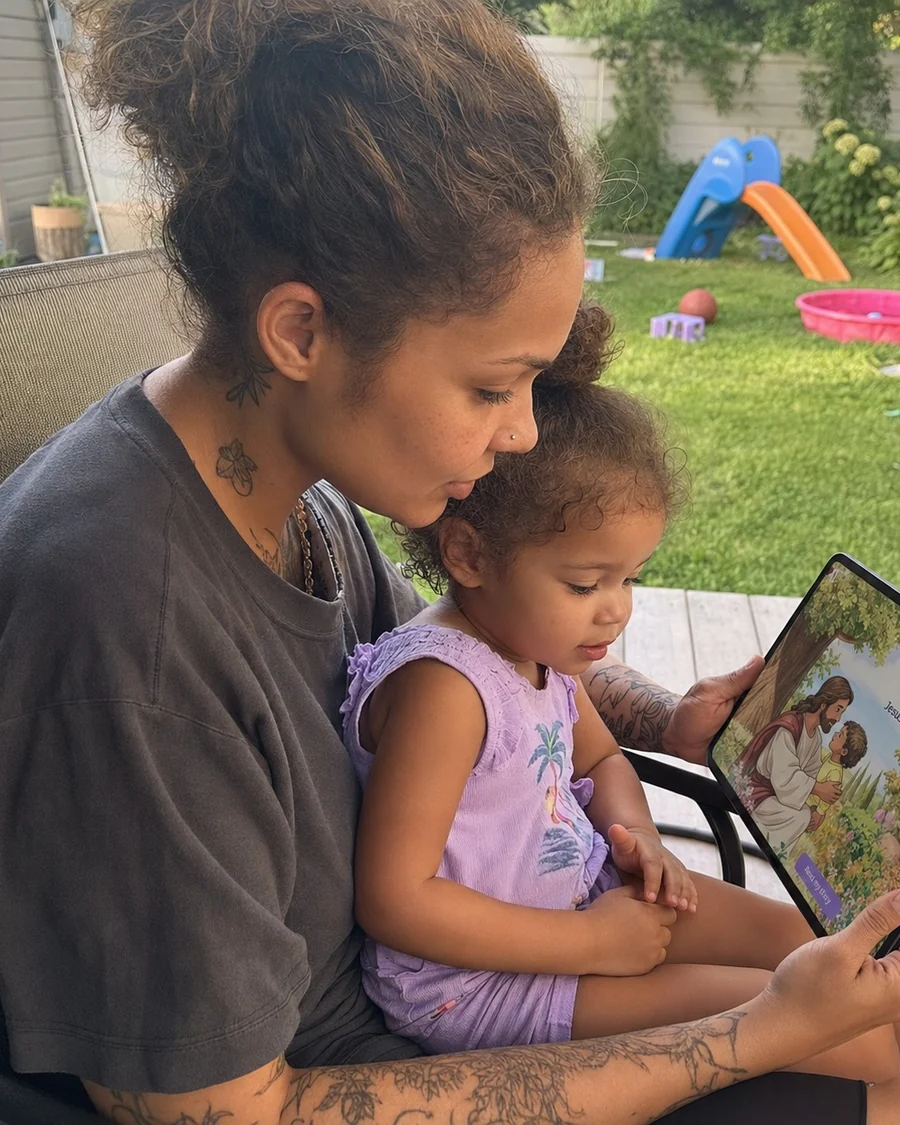 Melissa reading a personalized digital story with her child