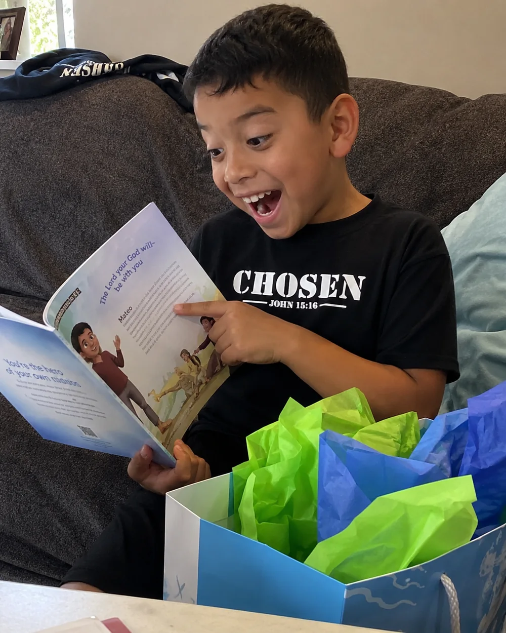 Mateo pointing at his personalized story