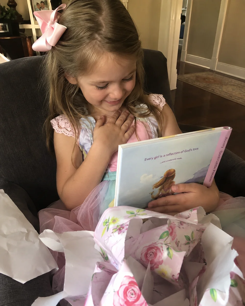 Child holding her personalized faith story